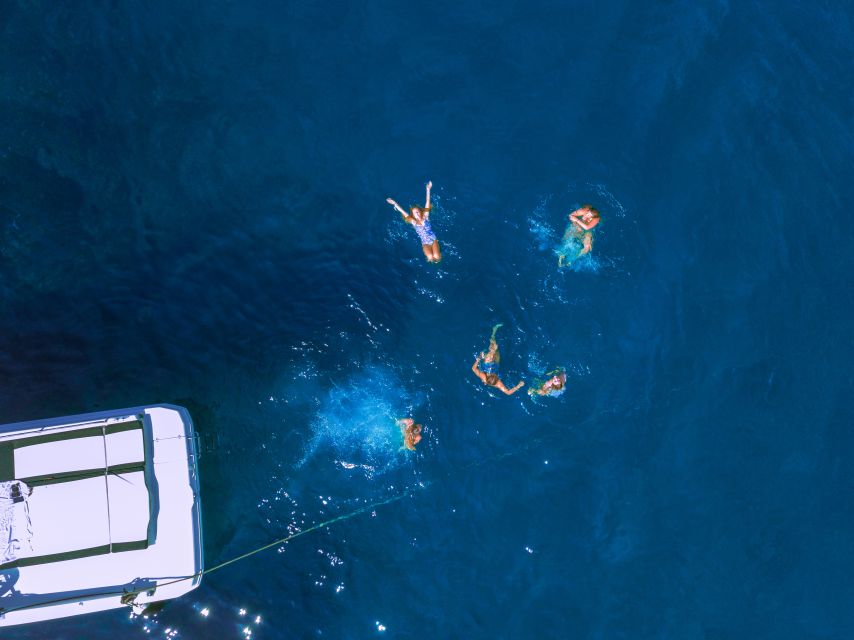 People swimming from boat Ultimate Guide Visiting to the Blue Cave, Montenegro