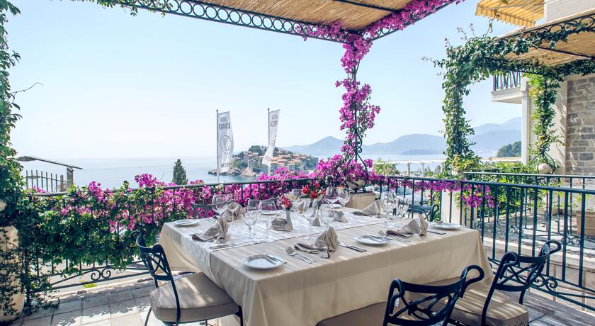 Hotel Azimut dining terrace Sveti Stefan Hotel Azimut has an indoor pool overlooking the hamlet and island of Sveti Stefan, Montenegro.