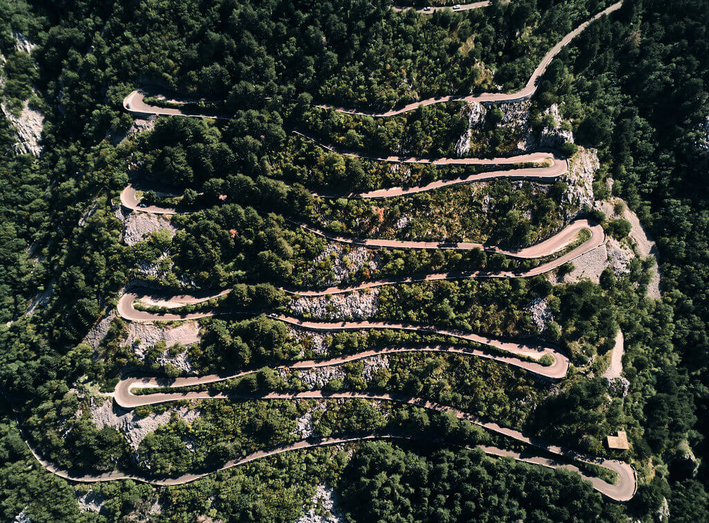Drive Montenegro’s famous serpentine road from Kotor to Lovćen Aerial view of the serpentine road from Kotor to Lovćen with 25 dramatic hairpin bends through the forest