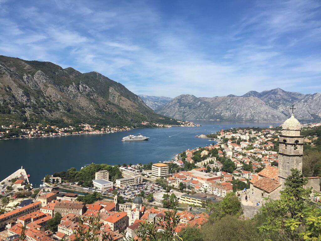 Bay of Kotor and Our Lady of Remedy Kotor walls walk up San Giovanni Fortress in Montenegro.