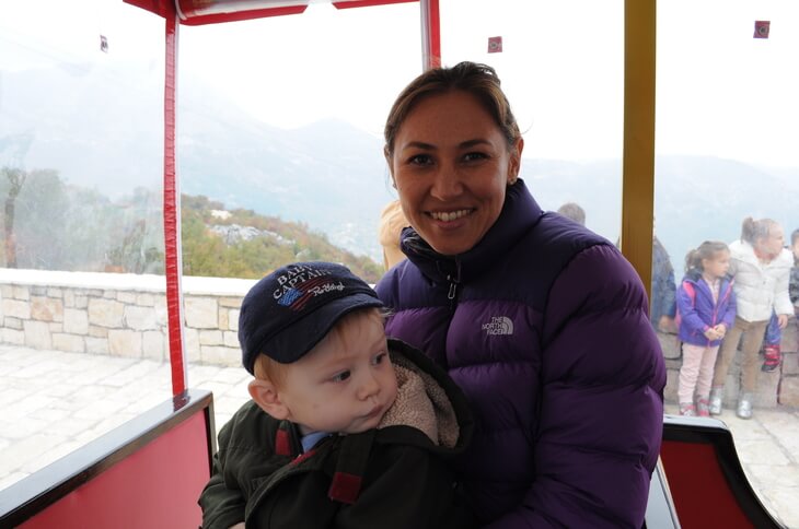 Sarah and Kai on Lipa Cave train Riding the train at the start of the Lipa Cave tour, just outside of Cetinje in Montenegro.