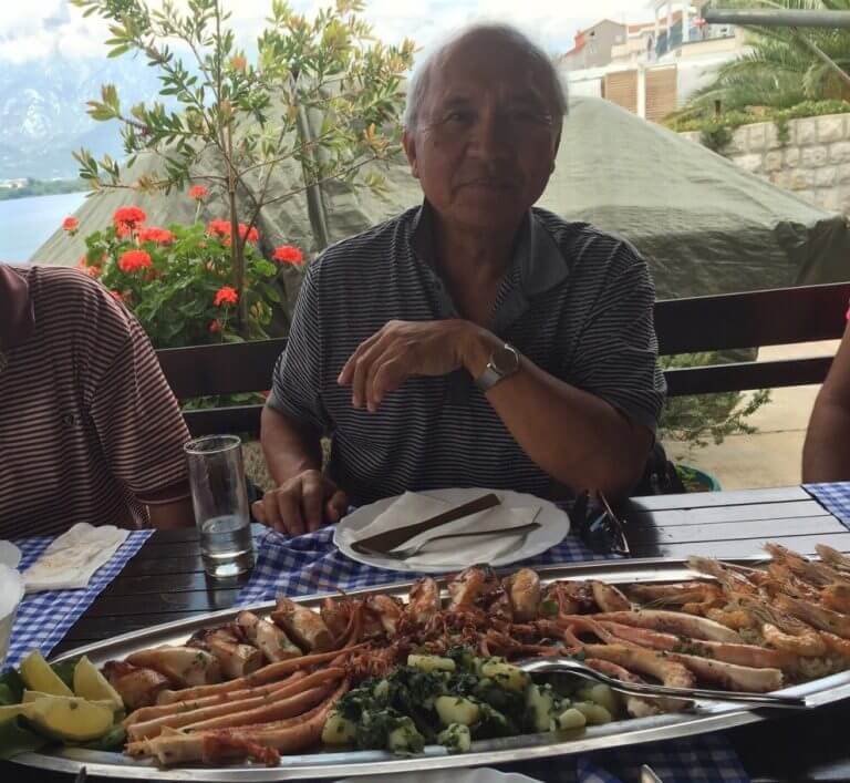Seafood feast by the bay – Dining at Maestral Restaurant near Kotor Fresh grilled seafood platter served with vegetables at a waterfront restaurant near Kotor, Montenegro
