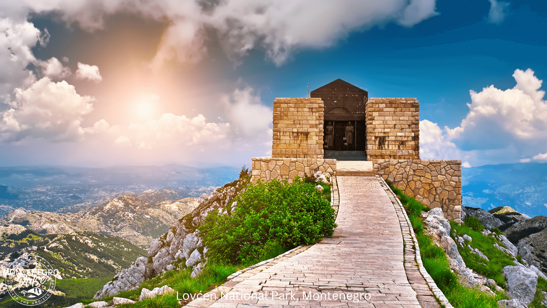 Path leading up to the Mausoleum at Lovcen National Park with panoramic views of the surrounding landscape.