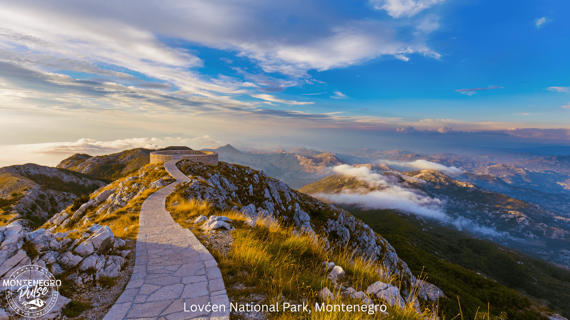 Path leading to the panoramic viewpoint at Lovcen National Park, with vast mountain views and dramatic sky in Montenegro.