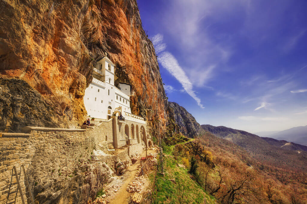 Guide to Visit Ostrog Monastery in Montenegro. Discover Ostrog Monastery - the history, the miracles, what to wear and how to get there.