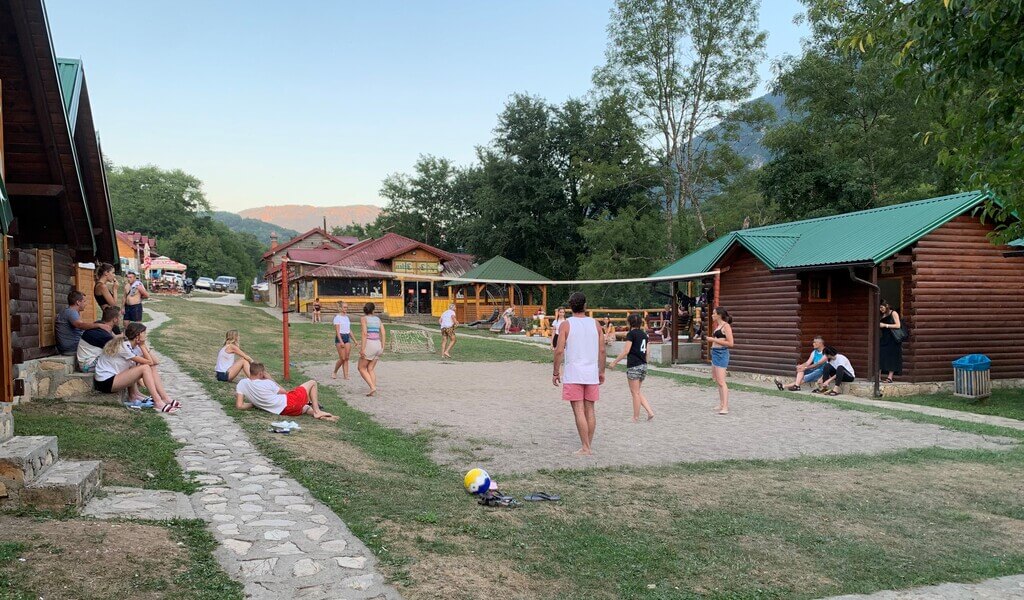 People playing volleyball at a rafting camp Discover some of Montenegro's most beautiful scenery on an exciting family-friendly adventure when you go rafting in Montenegro.