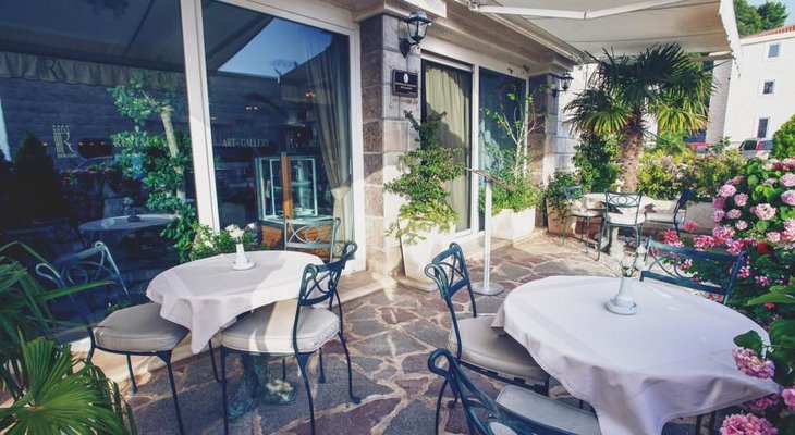 Hotel Romanov Terrace Sveti Stefan Hotel Romanov is a budget-friendly luxe option overlooking the hamlet and island of Sveti Stefan, Montenegro.