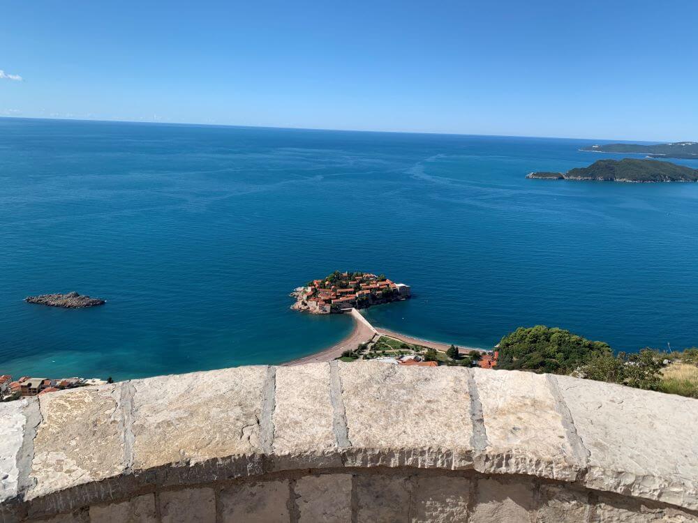 Sveti Stefan Island from Above, Montenegro Panoramic view of Sveti Stefan island connected by a narrow isthmus from a viewpoint above the Adriatic Sea, Montenegro.