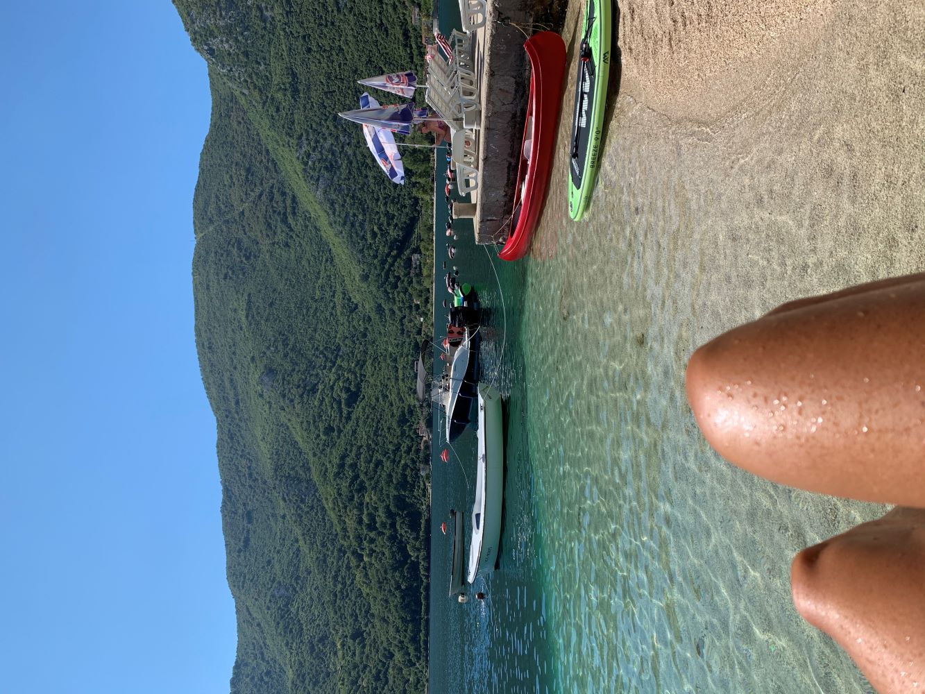 Sunbathing on beach in the Bay of Kotor in Montenegro